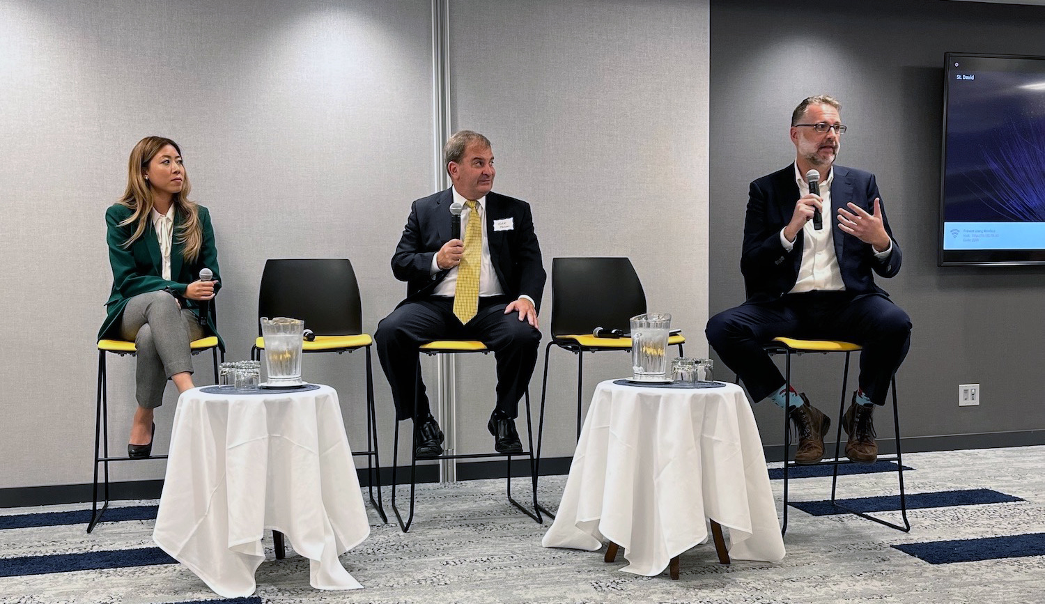 Isaac Straley speaking during a panel discussion.