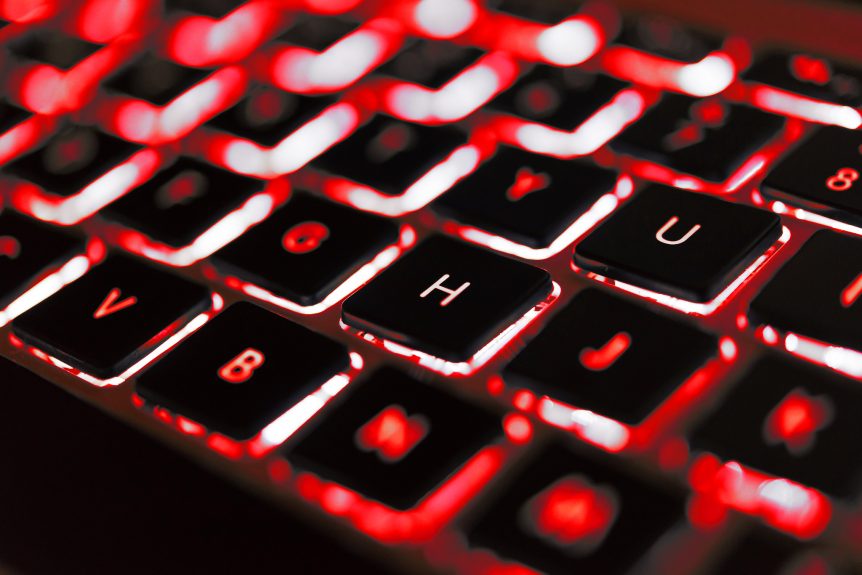 Photo of a keyboard with red under lighting